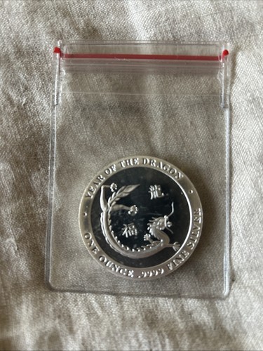 1oz silver round - silver, baird